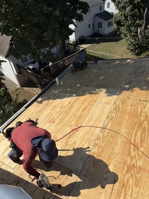 Crew installing new plywood roof decking on a home in Pompton Plains NJ