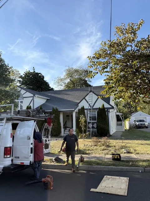 Capital T Construction crew and van on site at a Tudor-style home in Pompton Plains NJ